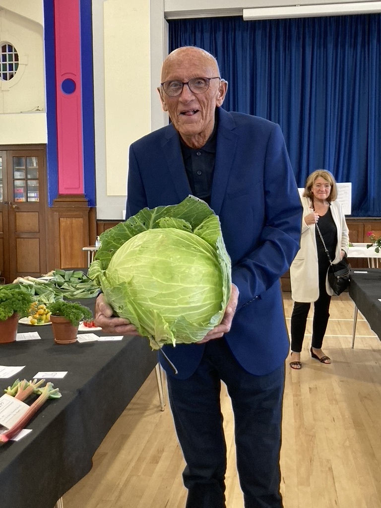 John Currie with his prize-winning 2022 cabbage